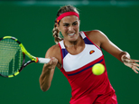 Monica Puig of Puerto Rico returns to Germany's Angelique Kerber in the gold medal match of the women's tennis competition at the 2016 Summer Olympics in Rio de Janeiro, Brazil, Saturday, Aug. 13, 2016. (AP Photo/Vadim Ghirda)