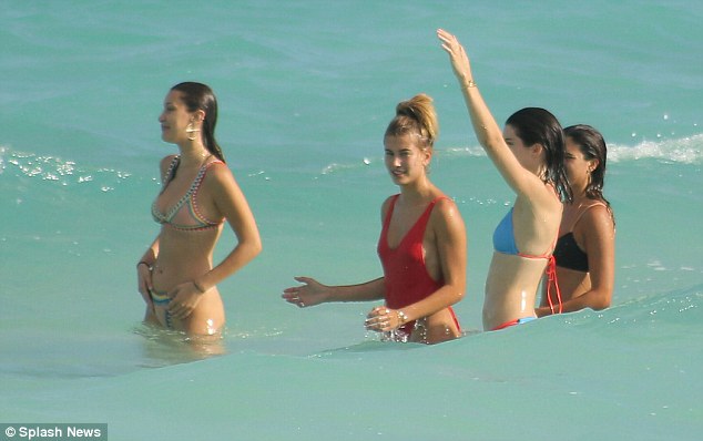 On duty: Kendall Jenner And Bella Hadid did not have to be afraid as the went for a swim because they had squad guard Hailey on patrol