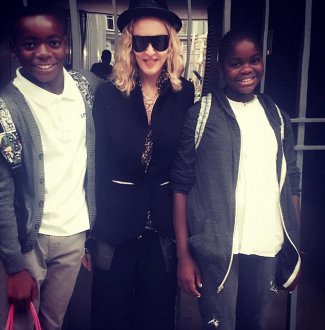 A family affair: On Tuesday, Madonna posted a picture of her two children David (left) and Mercy (right) as they returned to school