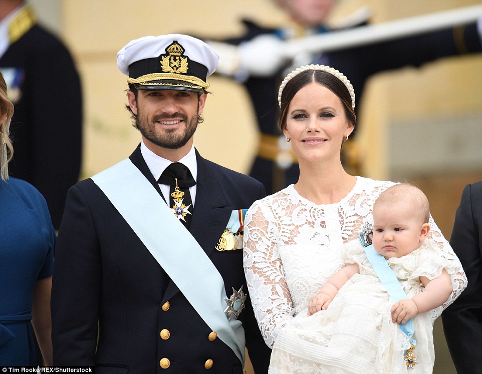 Resplendent in a white lace dress, pearl headband and cream satin heels, Princess Sofia, 31, beamed  flanked by her dapper husband, 37-year-old Prince Carl Philip