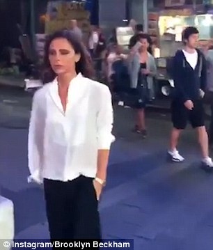 Causing a stir: She starts fist-pumping as people turn to stare at her