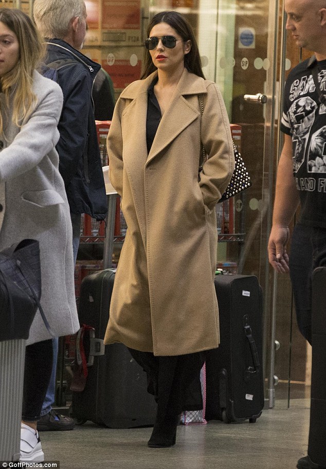 That looks familiar: The singer, 33, sported the same camel coat she wore for her journey to French capital the previous day as she made her way across King’s Cross St. Pancras train station