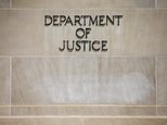 In this photo taken June 19, 2015, the Justice Department Building in Washington. A federal government contractor has been accused of removing highly classified information and storing the material in his house and car, federal prosecutors announced Wednesday, Oct. 5, 2016. The Justice Department announced a criminal complaint against Harold Thomas Martin III of Glen Burnie, Maryland. (AP Photo/Andrew Harnik)