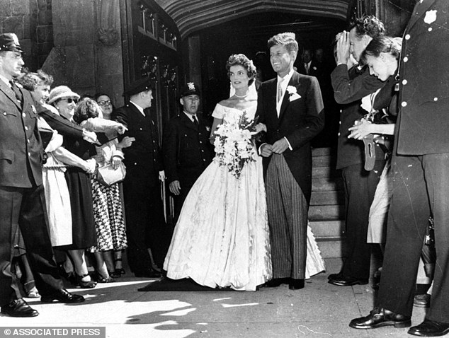 On September 12, 1953, Senator John F. Kennedy, D-Mass., leaves St. Mary's Church with his bride, the former Jacqueline Bouvier, after their wedding in Newport