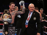 Ricky Burns, left, celebrates his victory in Glasgow