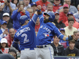 Toronto Blue Jays' Troy Tulowitzki (2) and Jose Bautista, right, celebrate Tulowitzki's two-run home run that scored Bautista in the second inning of Game 2 ...