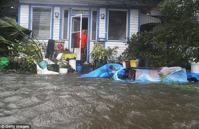 A river of water flooded down the streets of downtown and trapped many in their homes  