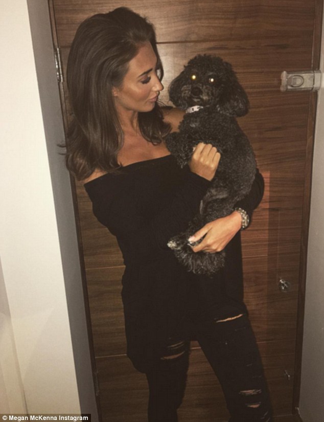 'So happy to be back home with my bubba': Cuddling her pet pooch back in Essex, the outspoken reality star's demeanour proved to be a far cry from her recent heartbreak 