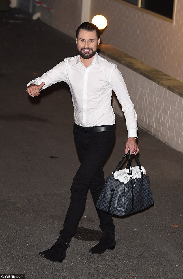 Dapper: Rylan Clark-Neal looked to be full of beans as he bound through the night in a white shirt and black trousers
