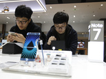 South Korean high school students try out Samsung Electronics Galaxy Note 7 smartphones at the company's shop in Seoul in Seoul, South Korea, Monday, Oct. 10...