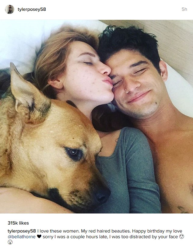 Cuddles: Posey on Sunday shared a bedside shot with the actress and his dog Roxy