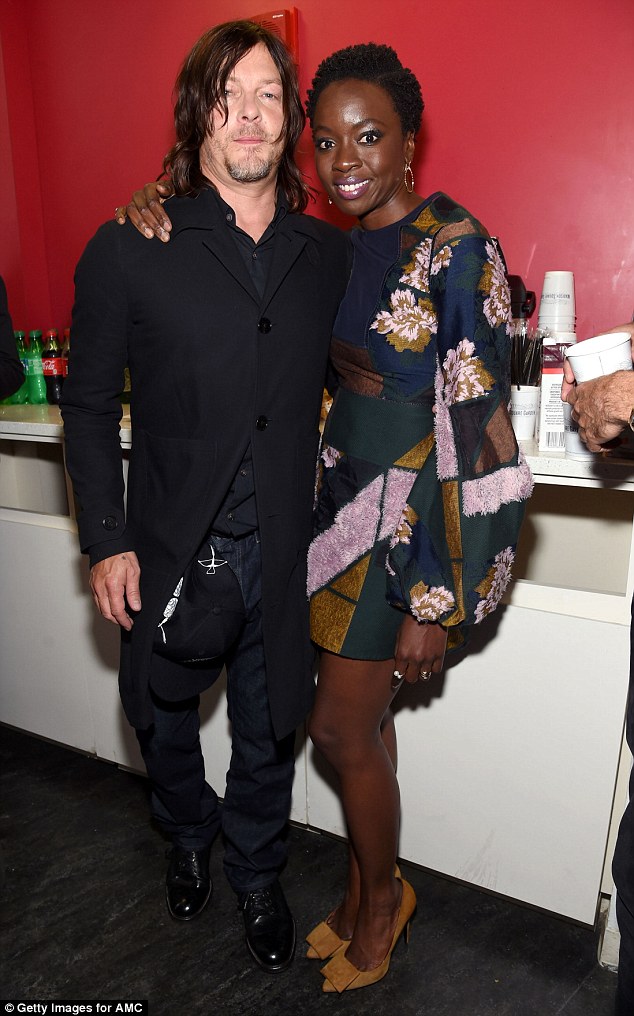 Hot cast: Reedus poses alongside co-star Danai Gurira, 38, who looked amazing in her glam get-up