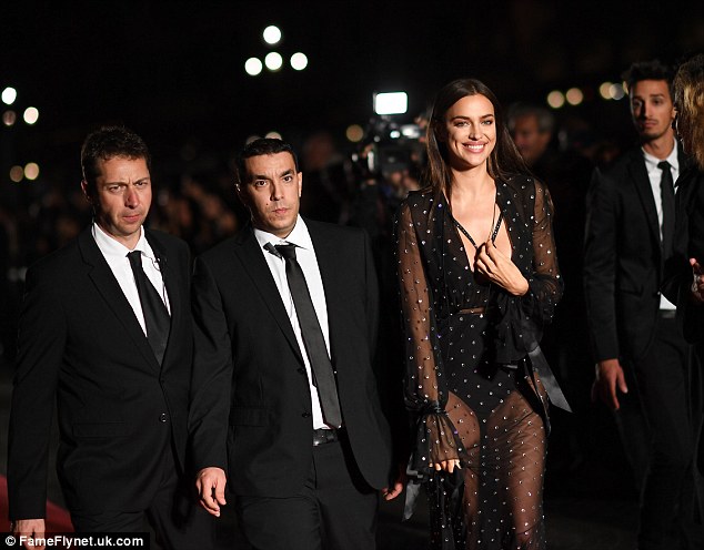Showstopper: Irina's beautiful smile lit up as the camera snapped away