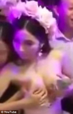 The identity of the woman is not yet known and some of those who viewed the video online suggested she was in fancy dress and that the footage was taken in a Thai cabaret night club filled with Chinese tourists