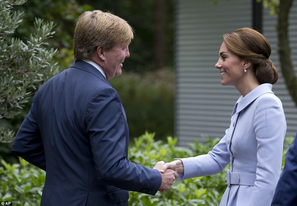 Kate, 34, looked elegant in a pale blue skirt suit by Catherine Walker as she made a courtesy call to King Willem-Alexander at Villa Eikenhorst this morning