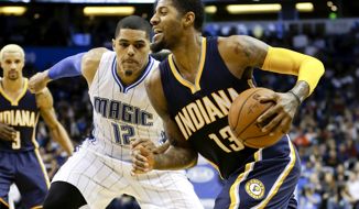 Indiana Pacers&#39; Paul George (13) drives around Orlando Magic&#39;s Tobias Harris (12) during the second half of an NBA basketball game, Wednesday, Jan. 6, 2016, in Orlando, Fla. Indiana won 95-86. (AP Photo/John Raoux)