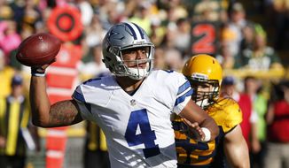 Dallas Cowboys&#39; Dak Prescott throws during the first half of an NFL football game against the Green Bay Packers Sunday, Oct. 16, 2016, in Green Bay, Wis. (AP Photo/Mike Roemer)
