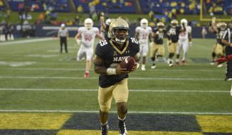 Navy running back Darryl Bonner (29) scores a touchdown during the second half of an NCAA football game against Houston, Saturday, Oct. 8, 2016, in Annapolis, Md. Navy won 46-40. (AP Photo/Nick Wass)