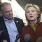 Democratic presidential candidate Hillary Clinton and Democratic vice presidential candidate Sen. Tim Kaine, D-Va. speak to reporters on board the campaign airplane, Saturday, Oct. 22, 2016, in Pittsburgh, Pa. (AP Photo/Mary Altaffer)
