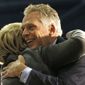 FILE This Monday Feb. 29, 2016 file photo shows Virginia Gov. Terry McAuliffe, right, as he hugs Democratic presidential candidate Hillary Clinton as she arrives to speak at a campaign rally in Norfolk, Va. Virginia was supposed to be a key battleground state and the high energy governor was expected to spend the weeks leading up to Election Day bouncing around the Old Dominion to help longtime pal Hillary Clinton win the state&#39;s 13 electoral votes. (AP Photo/Gerald Herbert)