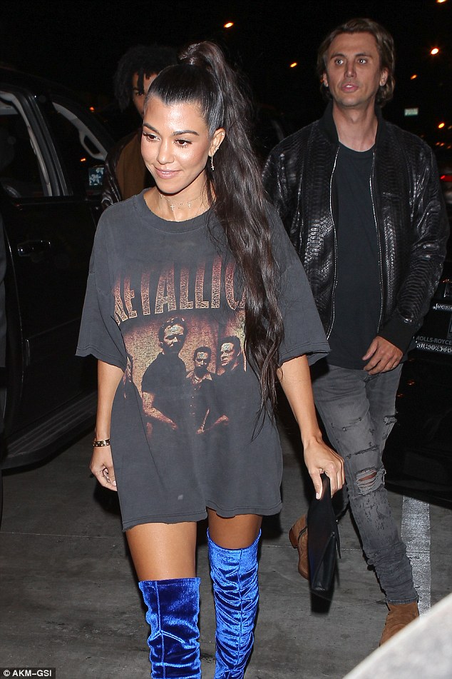 Hottie: Kourtney was dressed to impress in a Metallica shirt and over the knee blue velvet boots