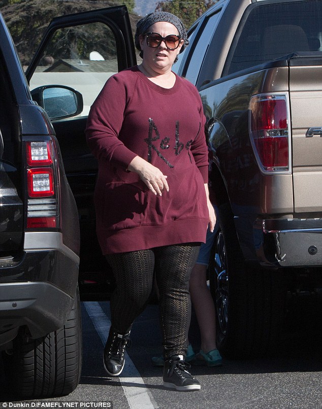 Casual Saturday: Melissa McCarthy, 46, sported a burgundy sweatshirt with a 'Rebel' statement in black on the front  as she dropped by a DIY store in Los Angeles