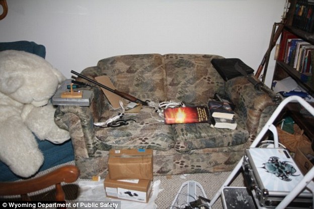 Bizarre: Inside his home police found giant stuffed animal toys surrounded by dismantled weapons