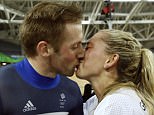 Laura Trott, right, kisses her fiance Jason Kenny, left, both of Britain, after he won the men's keirin cycling final at the Rio Olympic Velodrome during the 2016 Summer Olympics in Rio de Janeiro, Brazil, Tuesday, Aug. 16, 2016. (AP Photo/Patrick Semansky)