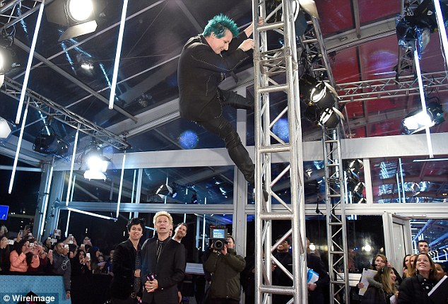 Soaring to new heights: Tré was seen climbing rigging during the band's appearance