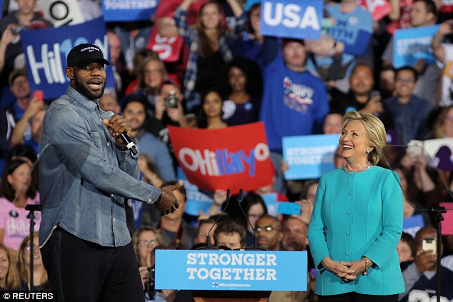 'This woman right here has the brightest future in the world,' James told a cheering crowd of about 4,000 who packed into Cleveland Public Auditorium