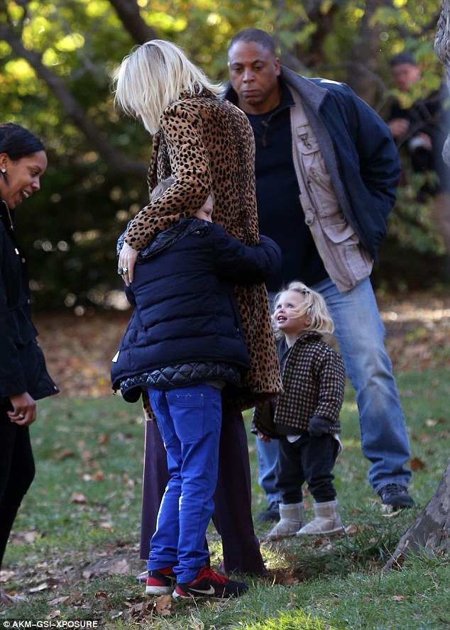 Famous offspring: Cate was seen embracing biological son Ignatius, 8, as little Edith watched on