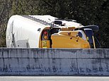 Officials work at the scene of a school bus crash on an interstate highway off-ramp Friday, Nov. 18, 2016, in Nashville, Tenn. Authorities say multiple students were injured, all of whom are expected to survive. (AP Photo/Mark Humphrey)