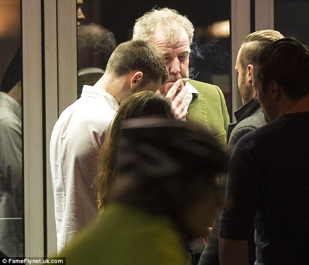 Guilty pleasure: The Yorkshire-born star puffed away on a cigarette as he chatted to friends outside the luxury cinema