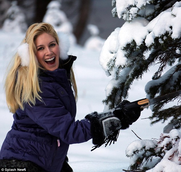 Blonde beauty! Heidi, 30, was a picture perfect snow bunny in white fuzzy earmuffs and pretty blue puffy jacket