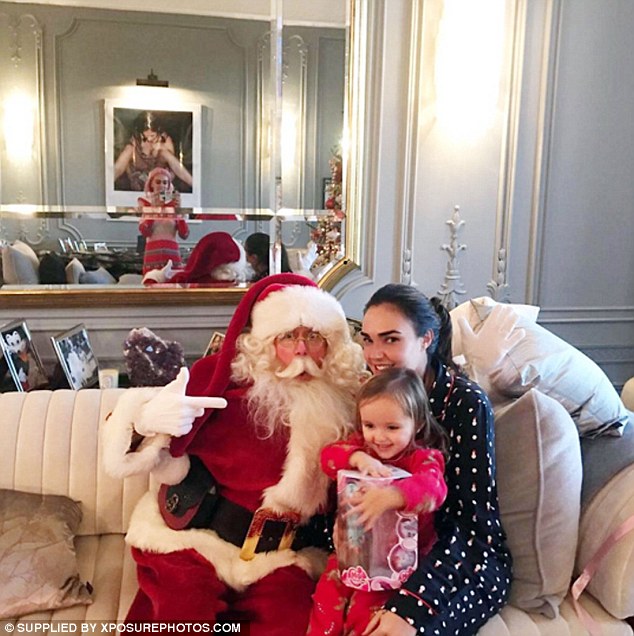 Look who came to visit! The family enjoyed a visit from Santa in one adorable Instagram snap 