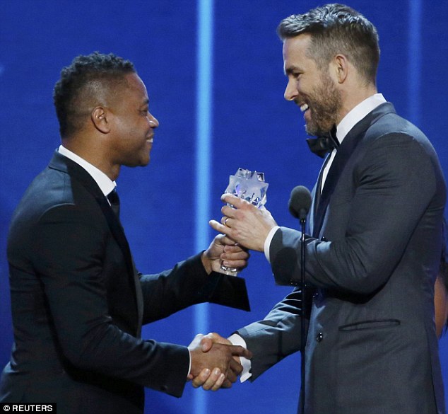 All smiles: The beefcake grinned as he was presented with the Best Comedy Actor award by Cuba Gooding Jr