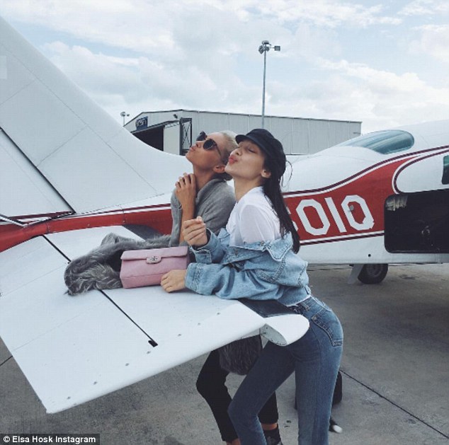 Being silly: The supermodel posed for several playful snaps with Bella, 19, using their private plane as a backdrop
