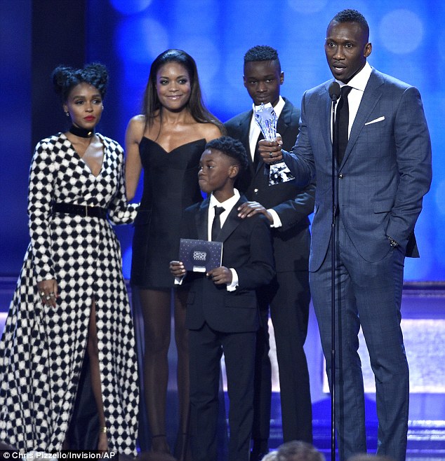 Success story: Naomie was on stage alongside co-stars Monae, Alex R. Hibbert, Ashton Sanders, and Mahershala Ali to accept the award for Best Acting Ensemble