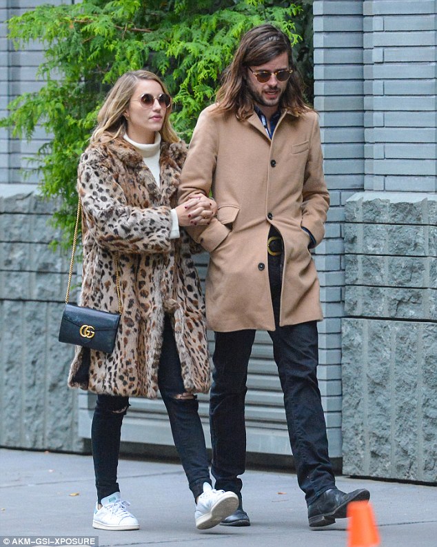 Cute: The Glee star, 30, rocked a chic leopard-print coat as she cosied up to the handsome 28-year-old Mumford & Sons rocker