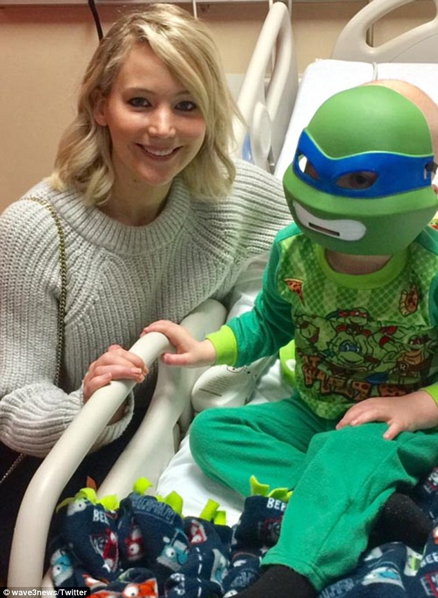 Lending her status for a good cause: Christmas Eve saw the Hunger Games star visit Norton Children's Hospital in her hometown - Louisville, Kentucky, according to Wave 3 News 