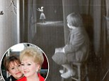 'She was mesmerized by her mother': Photographer who captured the iconic picture of Carrie Fisher watching mom Debbie Reynolds on stage reveals the pair's adoring relationship