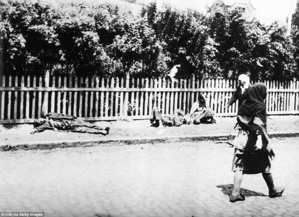 Women walk past people dying of starvation during Holodomor, a man-made famine in Soviet Ukraine in 1932 and 1933