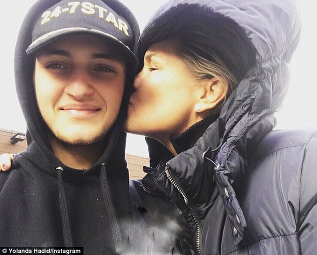 Sealed with a kiss: Yolanda shared a sweet kiss on her son Anwar's cheek while holidaying in Aspen