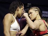 Ronda Rousey, right, and Amanda Nunes face off for photographers during an event for UFC 207, Thursday, Dec. 29, 2016, in Las Vegas. Rousey is scheduled to fight Nunes in a mixed martial arts women's bantamweight championship bout Saturday in Las Vegas. (AP Photo/John Locher)