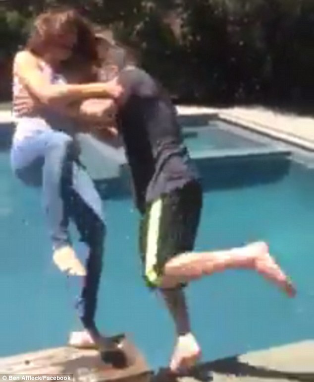 Quick reflexes: Shortly after Ben was drenched in the icy cold water, he grabbed his wife Jennifer Garner and jumped in the pool