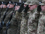 U.S. Army soldiers are welcomed in Zagan, Poland, Thursday, Jan. 12, 2017. First U.S. troops arrived at the Zagan base in western Poland as part of deterrence force of some 1,000 troops to be based here and reassure Poland that is worried about Russia's activity.(AP Photo/Czarek Sokolowski)