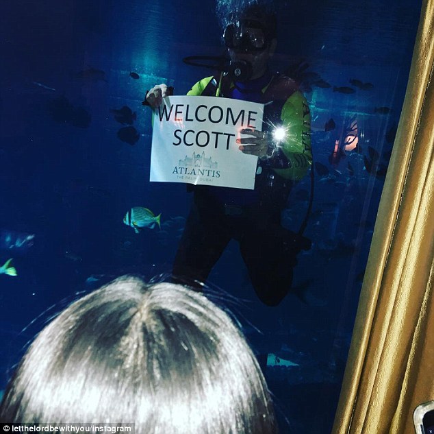 Back to old habits? The fashionista's tweet was posted within a few hours of a photo posted by Scott of him being welcomed to the resort by a person submerged in a large aquarium in scuba gear holding a sign that read, 'Welcome Scott'