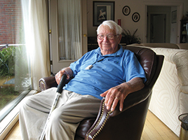 Patient of Population Health Management sitting in his home