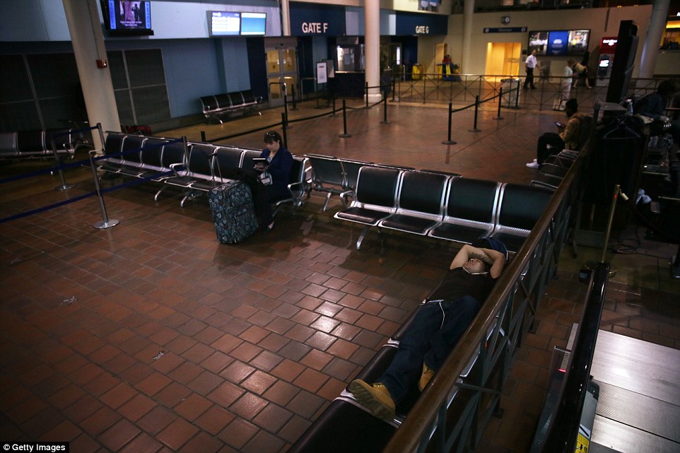 Quiet: An almost empty boarding area is seen at the usually-bustling Union Station in Washington D.C. due to the cancelled trains
