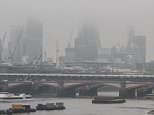 A mist descends on London as the country prepares to be battered by 100mph gales and heavy rain - before a killer cold snap of -10C sets in later this month